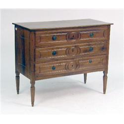 A NEOCLASSICAL CARVED WALNUT COMMODE