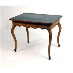 A PROVINCIAL BEECH AND CARVED CHERRYWOOD TOOLED LEATHER WRITING TABLE