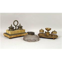TWO GILT-METAL-MOUNTED DESK GARNITURE SETS AND A COLORLESS GLASS INKWELL