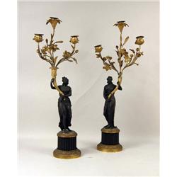 TWO SIMILAR NEOCLASSICAL FIGURAL GILT-METAL AND GILT-BRONZE THREE-ARM CANDELABRA