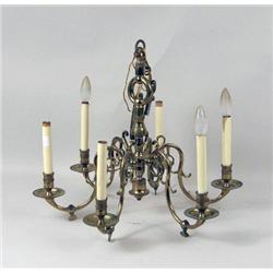 A CHIPPENDALE-STYLE SIX-ARM BRASS CHANDELIER