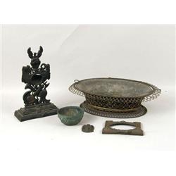 A PATINATED WHITE METAL POCKET WATCH HOLDER