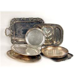 A GROUP OF EIGHT SILVER-PLATED TRAYS