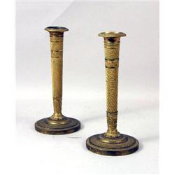 A PAIR OF LOUIS XVI GILT METAL CANDLESTICKS