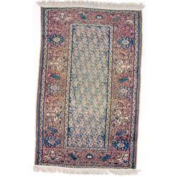 AN ORIENTAL RUG