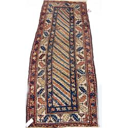 AN ORIENTAL RUG