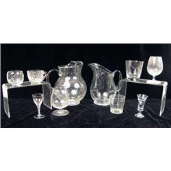 A LARGE LOT OF COLORLESS GLASS BAR WARE