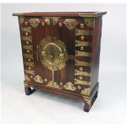 A BRASS-MOUNTED TROPICAL HARDWOOD CABINET ON STAND