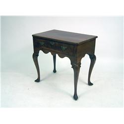 A GEORGE II CARVED AND FIGURED MAHOGANY DRESSING TABLE