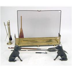 A PAIR OF CAST-IRON BLACK LABRADOR DOG-SHAPED ANDIRONS