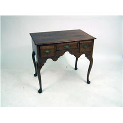 A QUEEN ANNE CARVED AND FIGURED WALNUT DRESSING TABLE