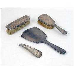 A THREE-PIECE STERLING SILVER HANDLED DRESSER SET