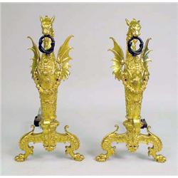 A PAIR OF HIGHLY ORNATE GILT METAL GRYPHON-AND SNAKE-HOOP-FORM ANDIRONS