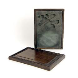 A CHINESE DRAGON-CARVED INKSTONE