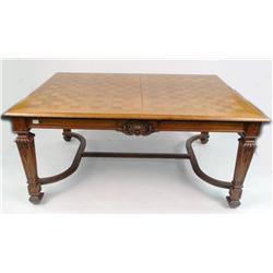 A CARVED QUARTER-SAWN OAK DINING TABLE