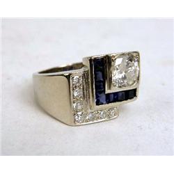 A 14K WHITE GOLD, DIAMOND AND SAPPHIRE RING