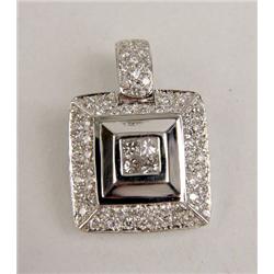 A 14K WHITE GOLD AND DIAMOND PENDANT