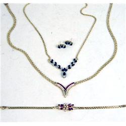 A 14K YELLOW GOLD, DIAMOND AND RUBY NECKLACE AND BRACELET SUITE