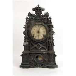 A VICTORIAN CAST-IRON GOTHIC REVIVAL MANTLE CLOCK