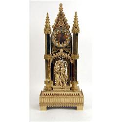 A VICTORIAN GOTHIC REVIVAL CAST-BRASS MANTLE CLOCK