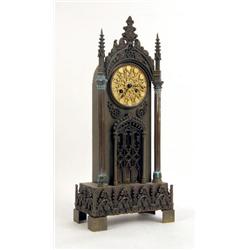 A VICTORIAN GOTHIC REVIVAL BRASS MANTLE CLOCK