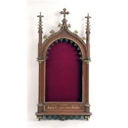 A VICTORIAN GOTHIC REVIVAL PARCEL-GILT AND STAINED PINE NICHE