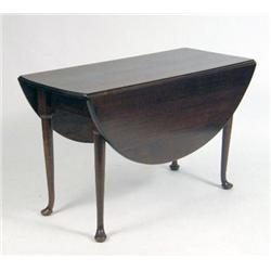 A GEORGE I WALNUT DROP LEAF DINING TABLE