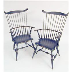 A PAIR OF BLACK-PAINTED COMB-BACK-STYLE WINDSOR ARMCHAIRS