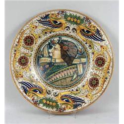 A TIN-GLAZED EARTHENWARE POLYCHROME-DECORATED CHARGER