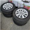 Image 1 : 4 VW 5 BOLT 15" RIMS AND BRIDGESTONE TIRES ABOUT 40% TREAD