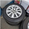 Image 2 : 4 VW 5 BOLT 15" RIMS AND BRIDGESTONE TIRES ABOUT 40% TREAD