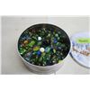 Image 1 : Metal tin filled with marbles