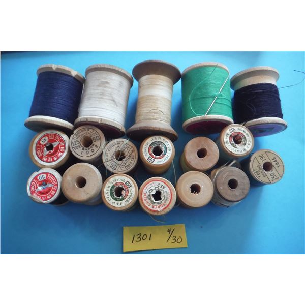 assorted sewing thread on wooden spools
