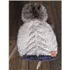 Image 1 : Merino wool toque with lynx fur pom pom and a amethyst and quartz crystal bracelet with a turquoise
