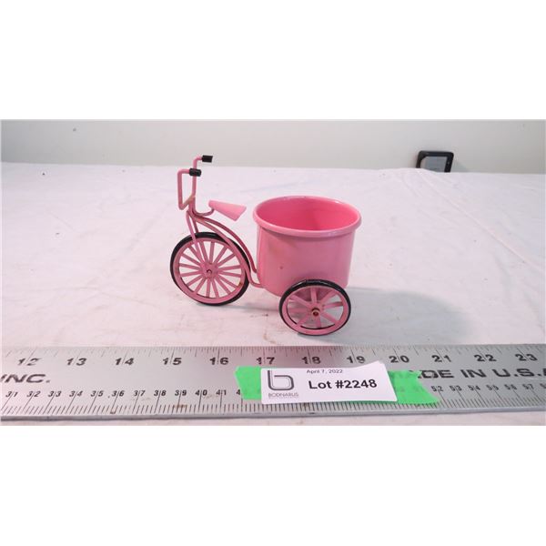 pink bike with pot art piece