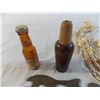 Image 2 : wooden duck whistle, shell necklace, odd wrench, mini bud bottle