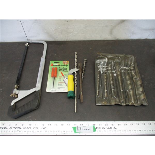Auger bit, cement bit, hacksaw, tube caps
