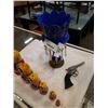 Image 2 : UNIQUE CANDLE HOLDER WITH NESTING DOLLS AND TOY SIX SHOOTER