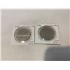 Image 1 : Two Canadian $1 coins
