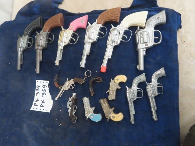 15 Cap Guns , some Key Chains