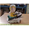 Image 1 : Ceramic Lawn Ornament, Kid on Snowmobile, Missing 1 Ski