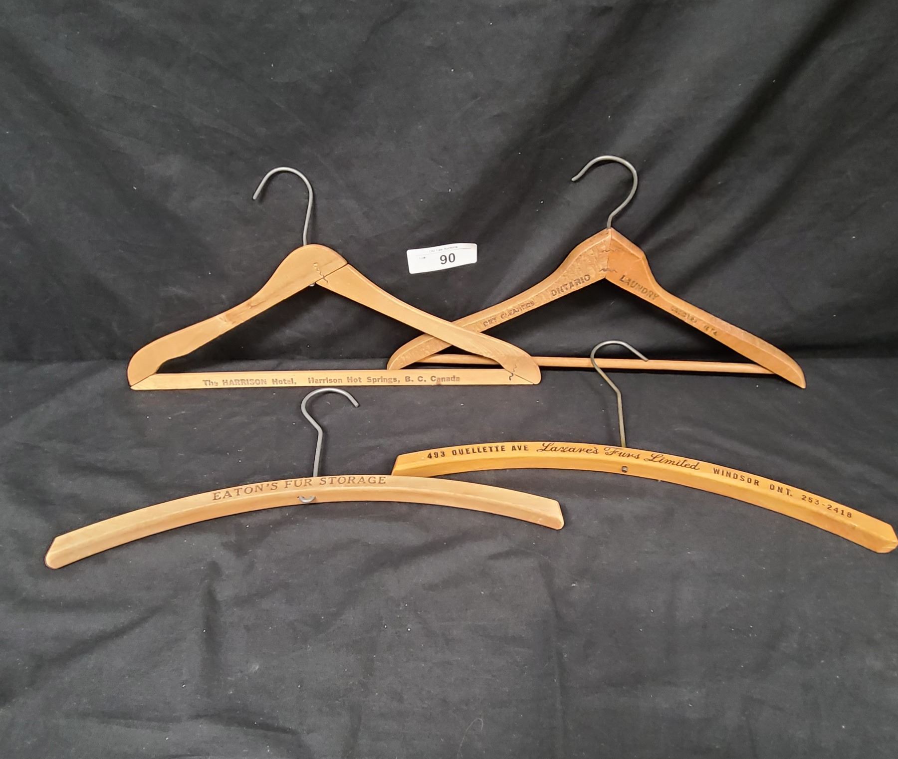 FOUR ANTIQUE WOODEN COAT HANGERS
