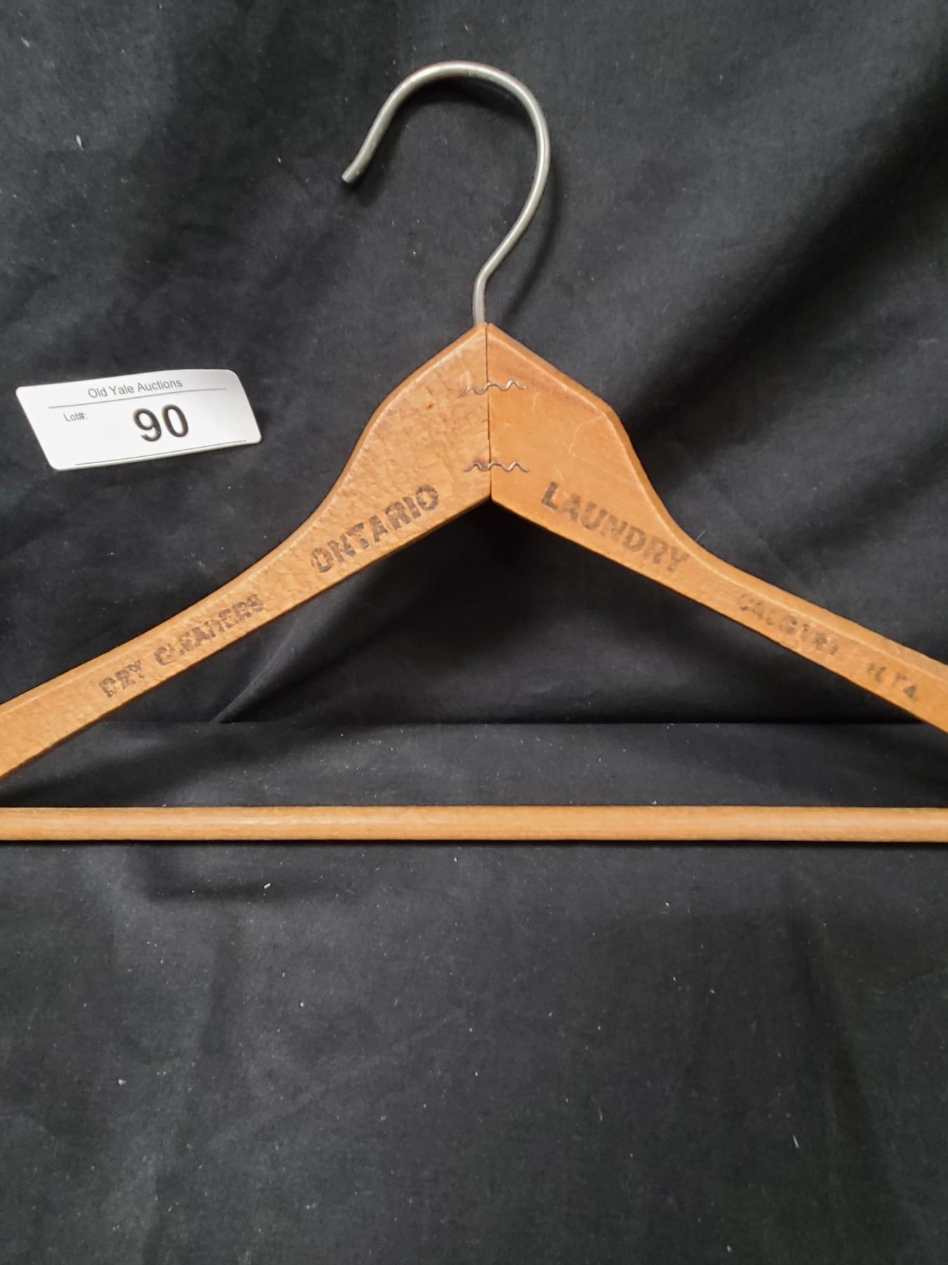 FOUR ANTIQUE WOODEN COAT HANGERS