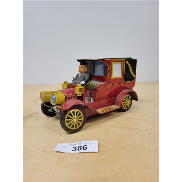 VINTAGE BATTERY OPERATED CHAUFFER TIN TOY