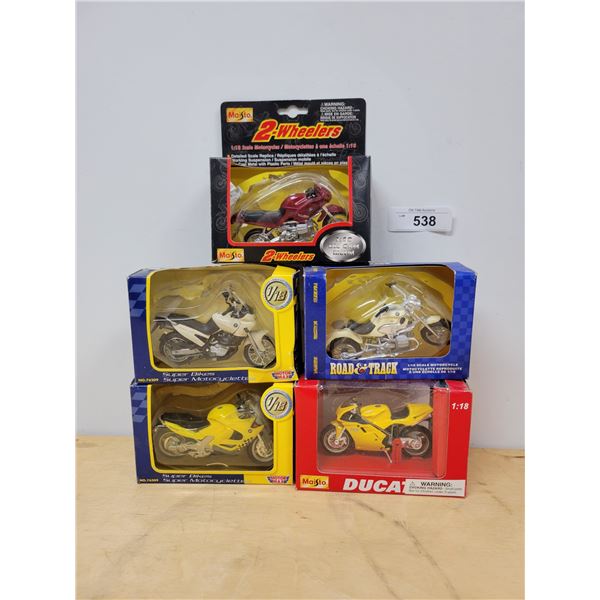 FIVE UNOPENED PACKAGE DIE CAST MOTORCYCLES