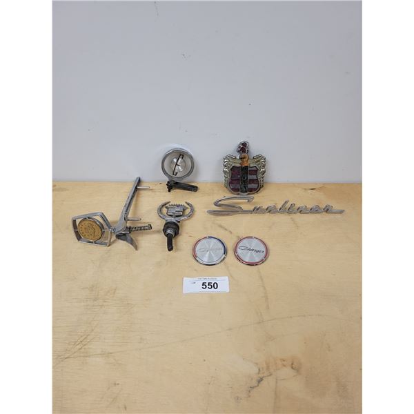 SEVEN ASSORTED VINTAGE CAR EMBLEMS & HOOD ORNAMENTS