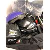 Image 2 : Table Lot of Four Bins and One Hockey Bag full of Skates , Hockey Bags & Helmets and more from the H