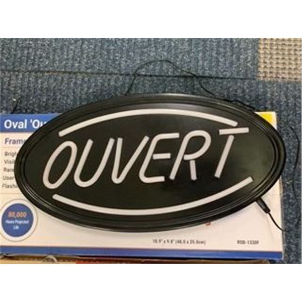 Two Neon Signs - "OUVERT" and "it was all a dream"