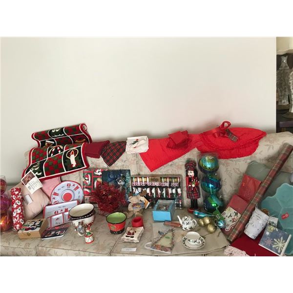 Massive Assortment of Christmas Décor including Rug, Dishes, Crackers, Napkins, Nutcracker, Ornament