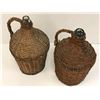 Image 2 : Two antique glass bottles in woven wicker handled coverings from movie set